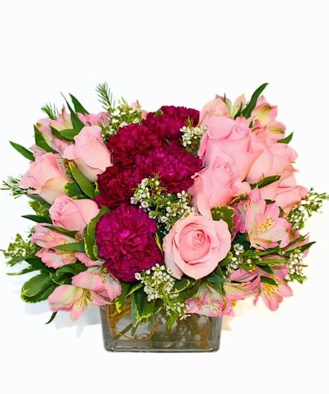 Pretty pink roses with soft lavender carnations and alstroemeria highlight this delightful bouquet.